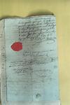 Document portant un cachet de cire rouge